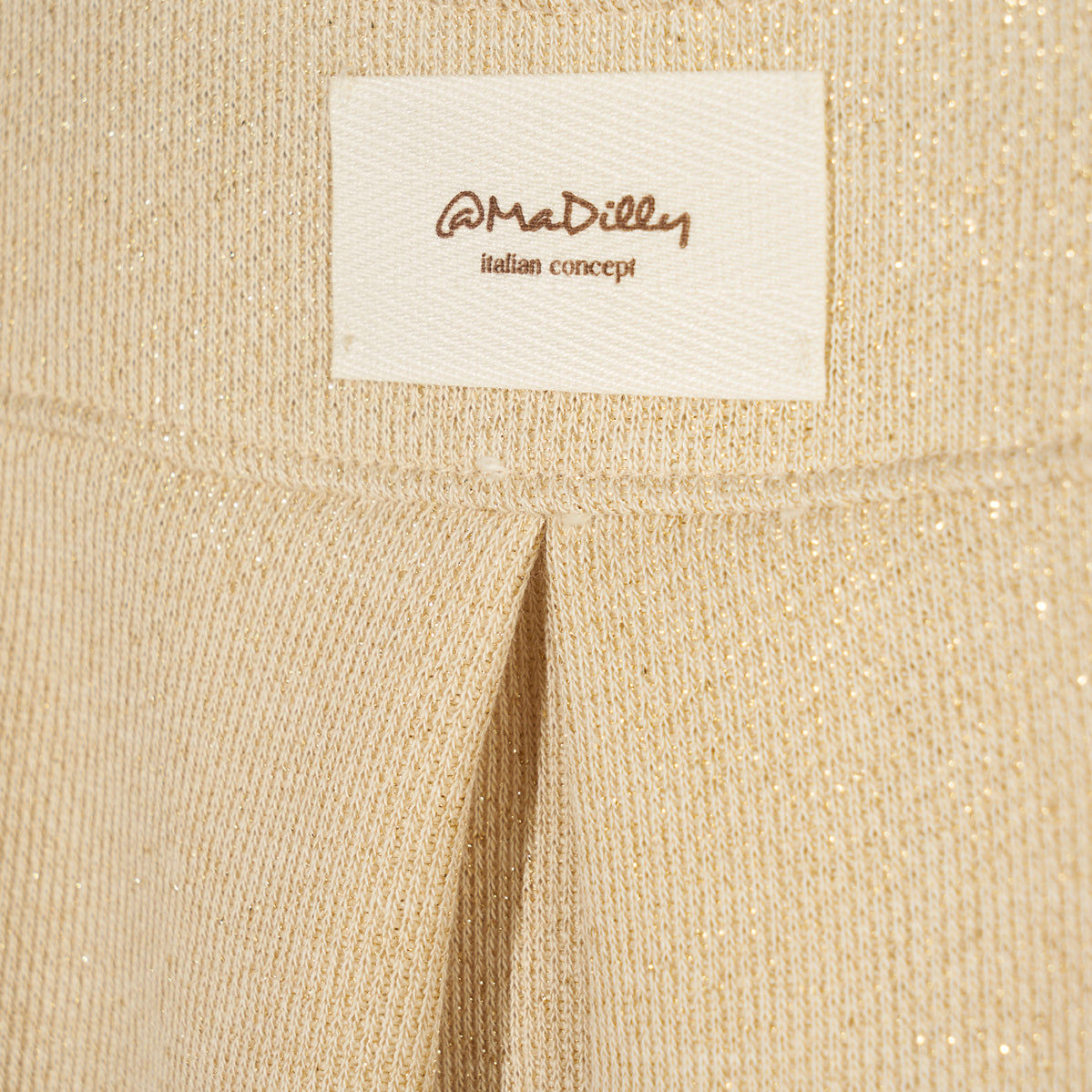 Felpa in lurex oro con spacco sul retro