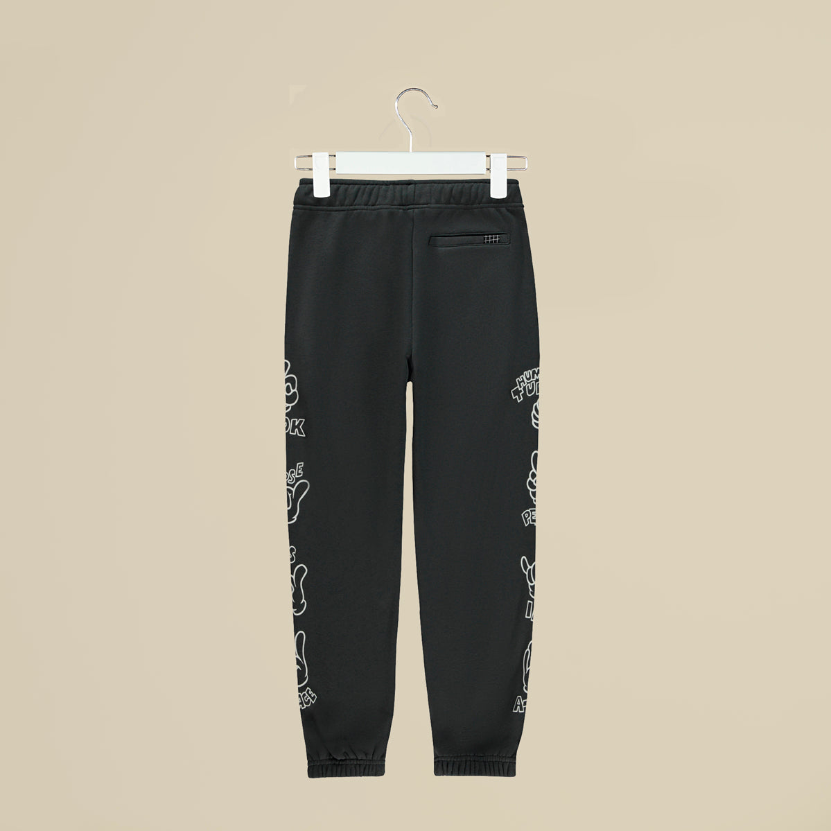 Pantalone in tuta grigia con simboli sui fianchi