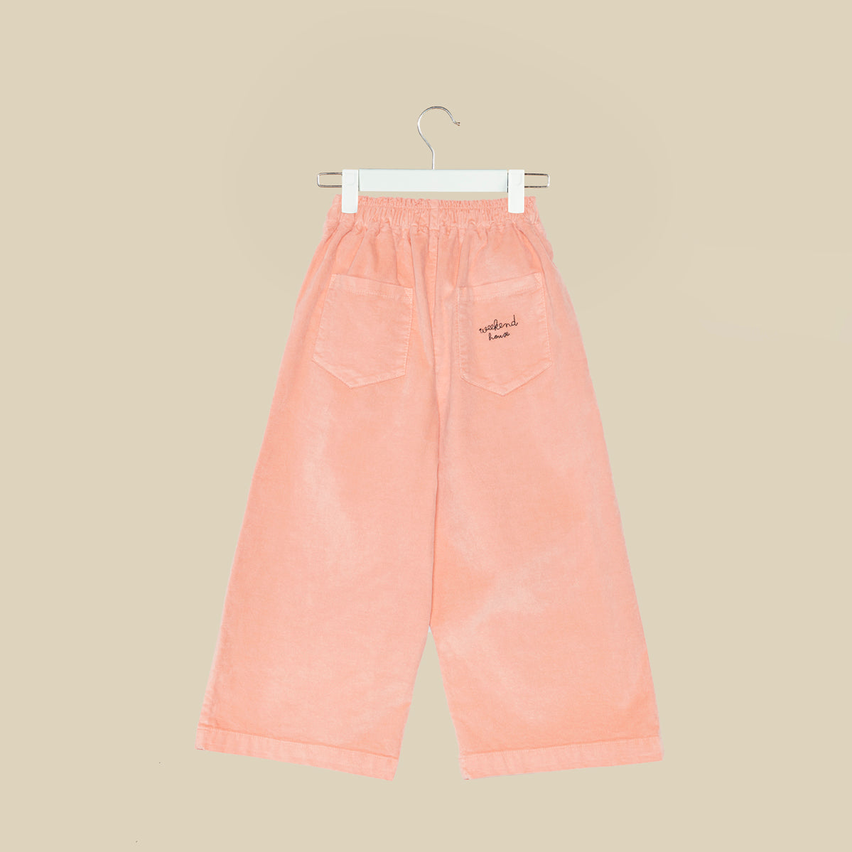 Pantalone svasato in velluto rosa chiaro