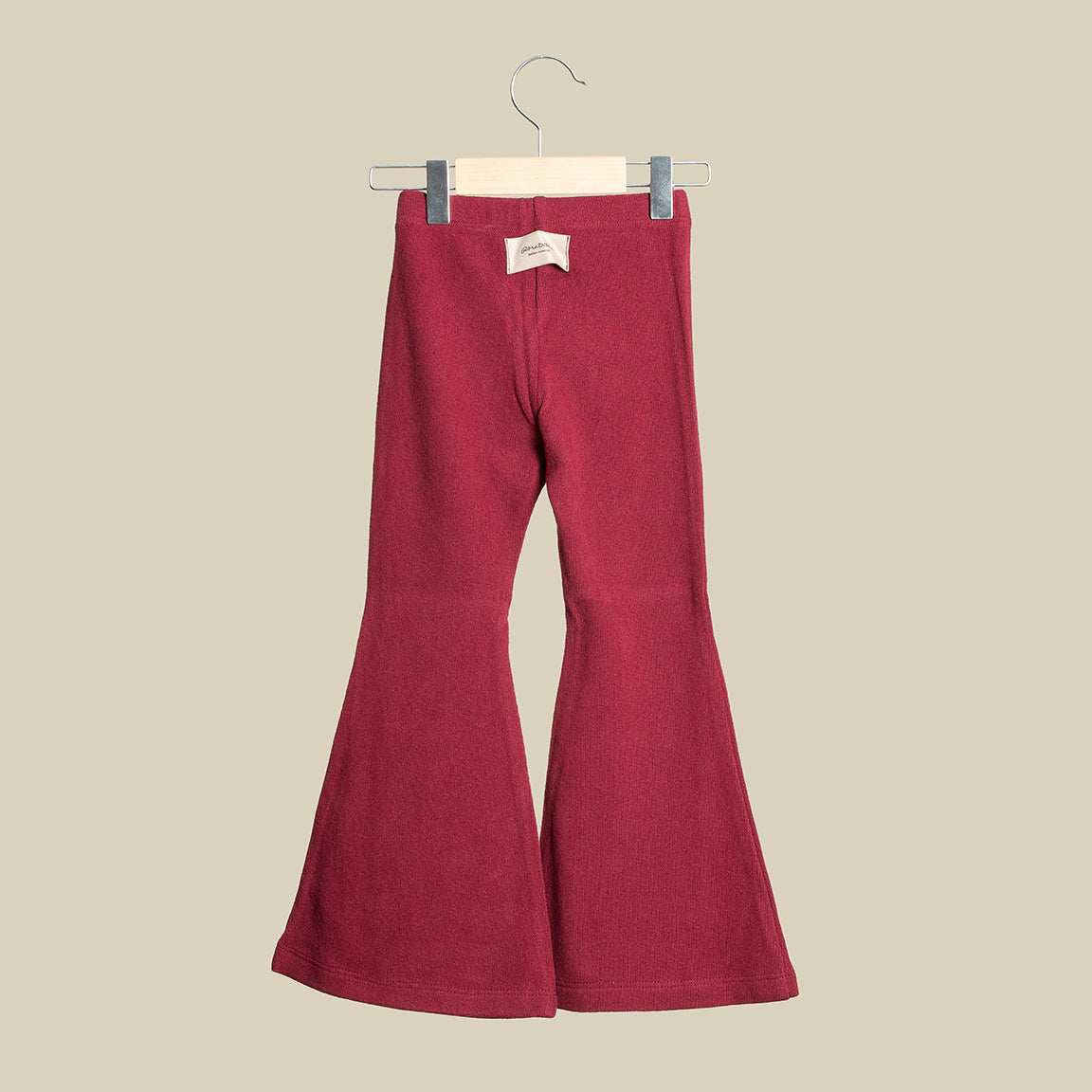 Pantalone scampanato in caldo cotone color granata