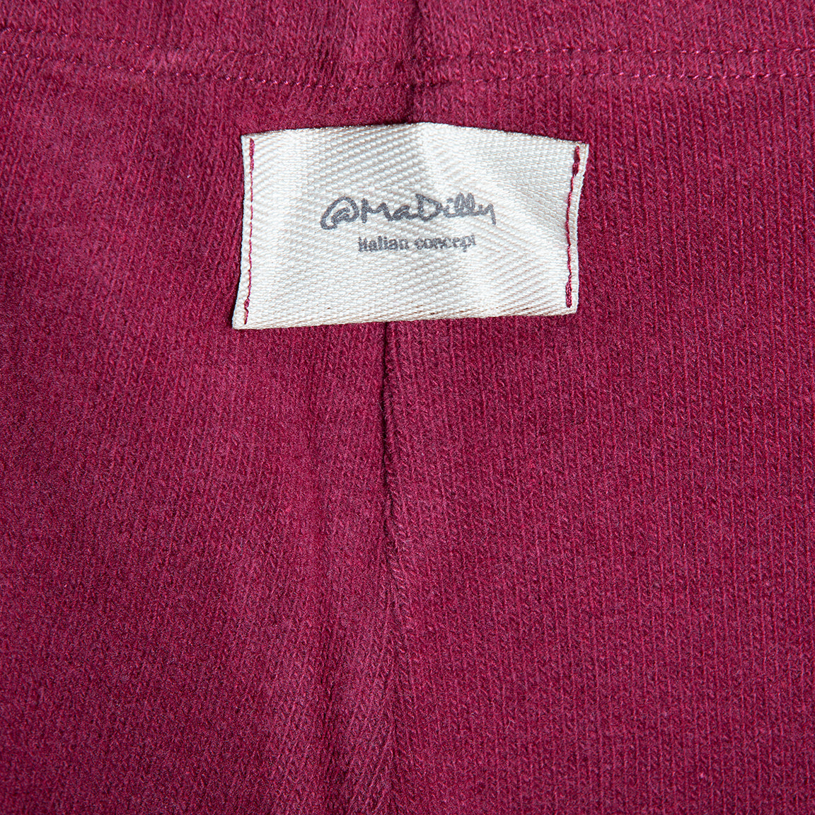 Pantalone scampanato in caldo cotone color granata