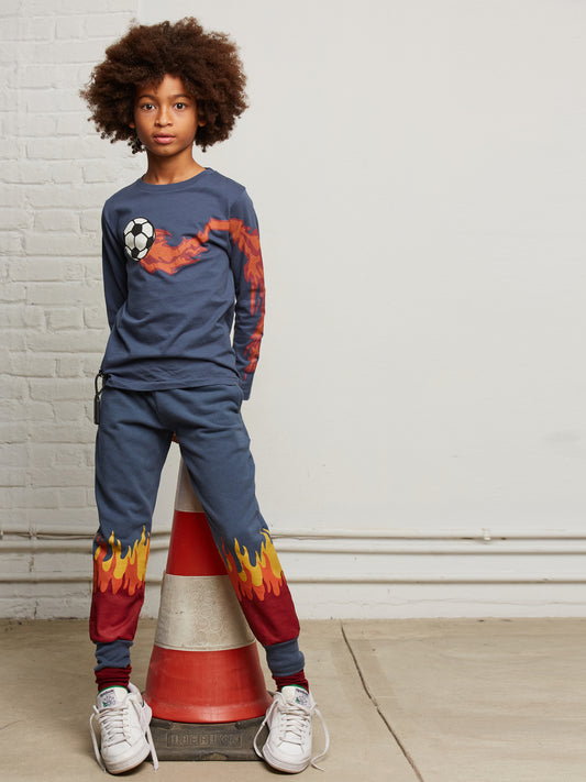 Pantalone jogger con stampa fiamme