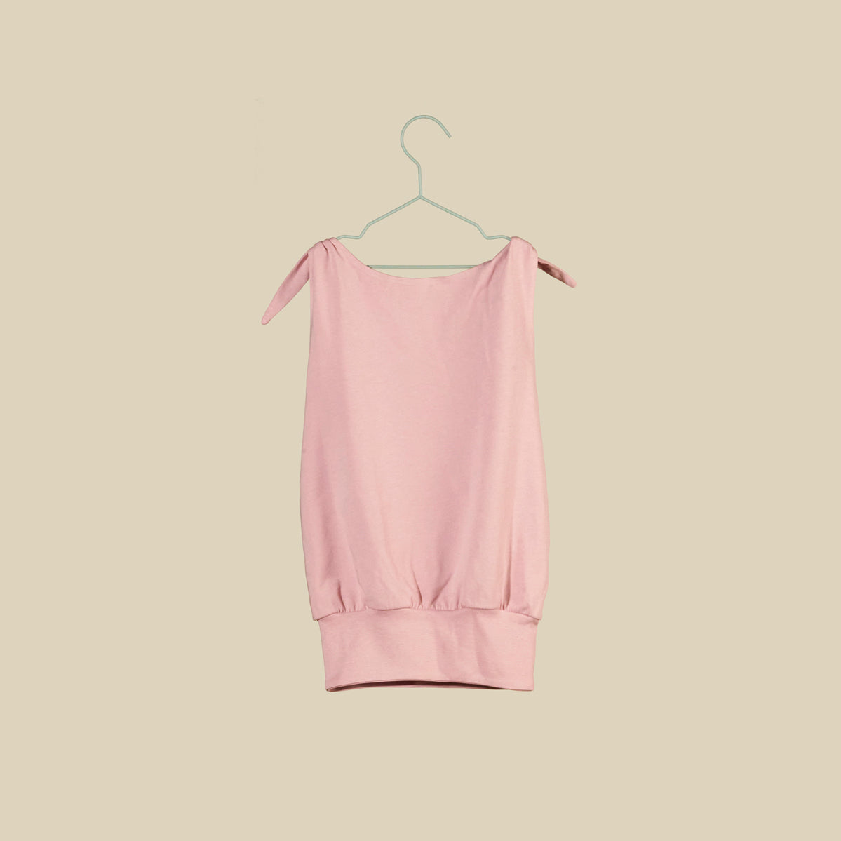 Top o mini abito rosa chiaro senza maniche con nodi