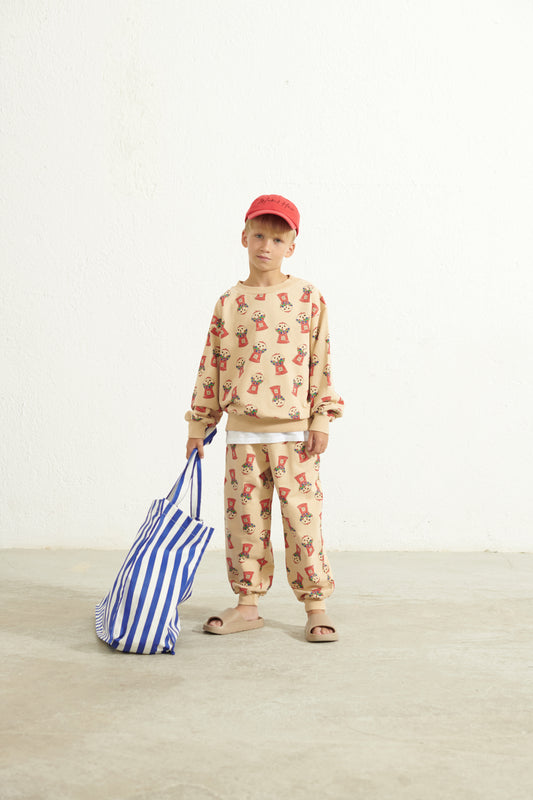 Pantalone in tuta beige con distributore cicche