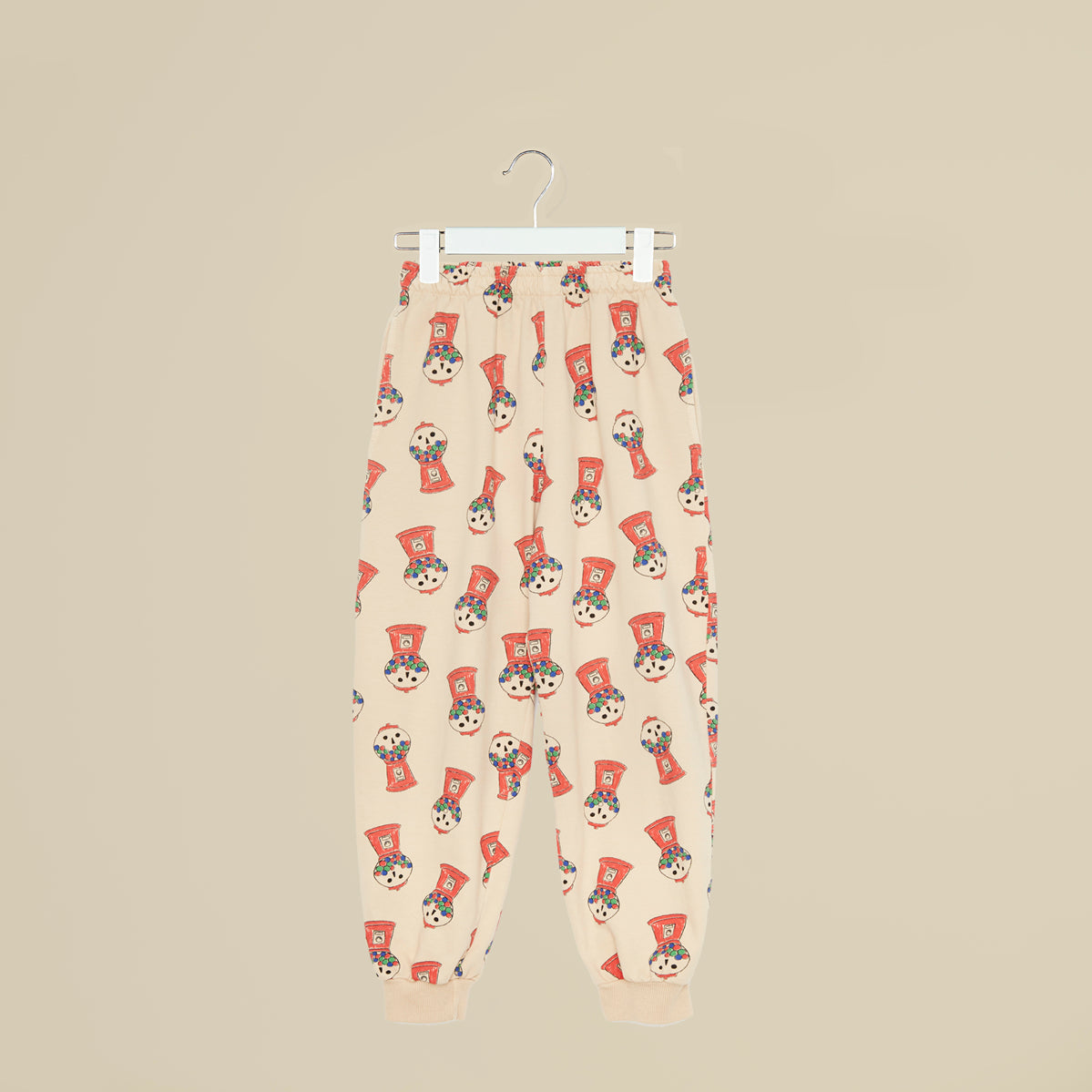 Pantalone in tuta beige con distributore cicche