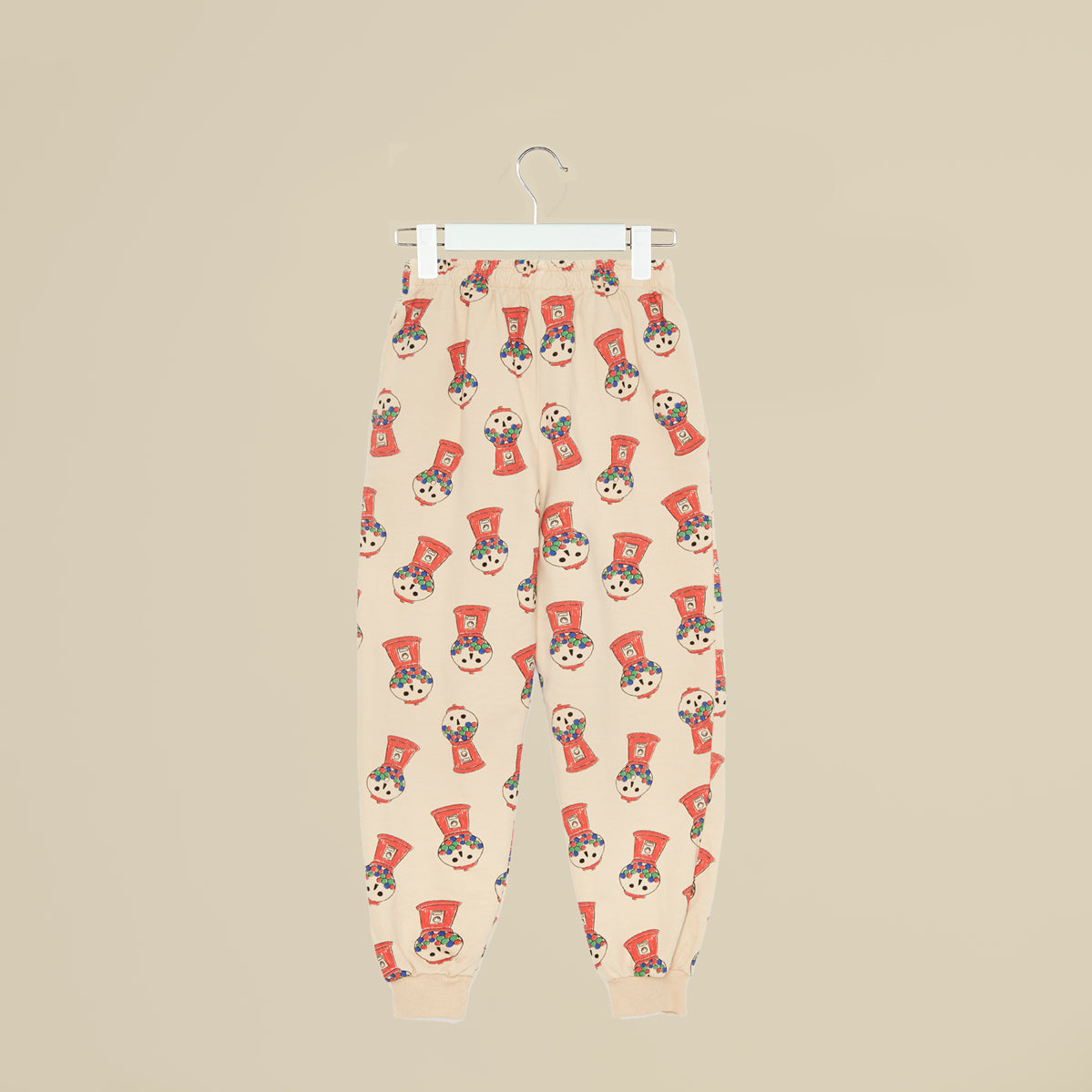 Pantalone in tuta beige con distributore cicche