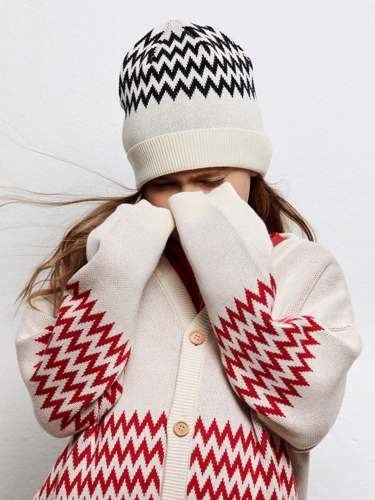 Cappellino in cotone bianco con disegni zigzag neri