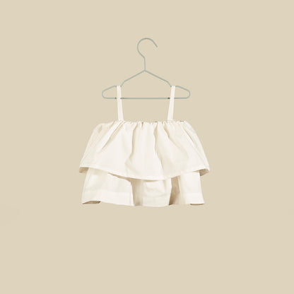 Top bianco con spalline sottili e balze