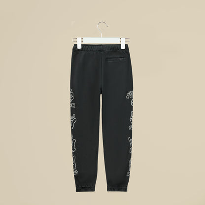 Pantalone in tuta grigia con simboli sui fianchi