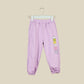 Pantalone jogger lilla con logo sul lato