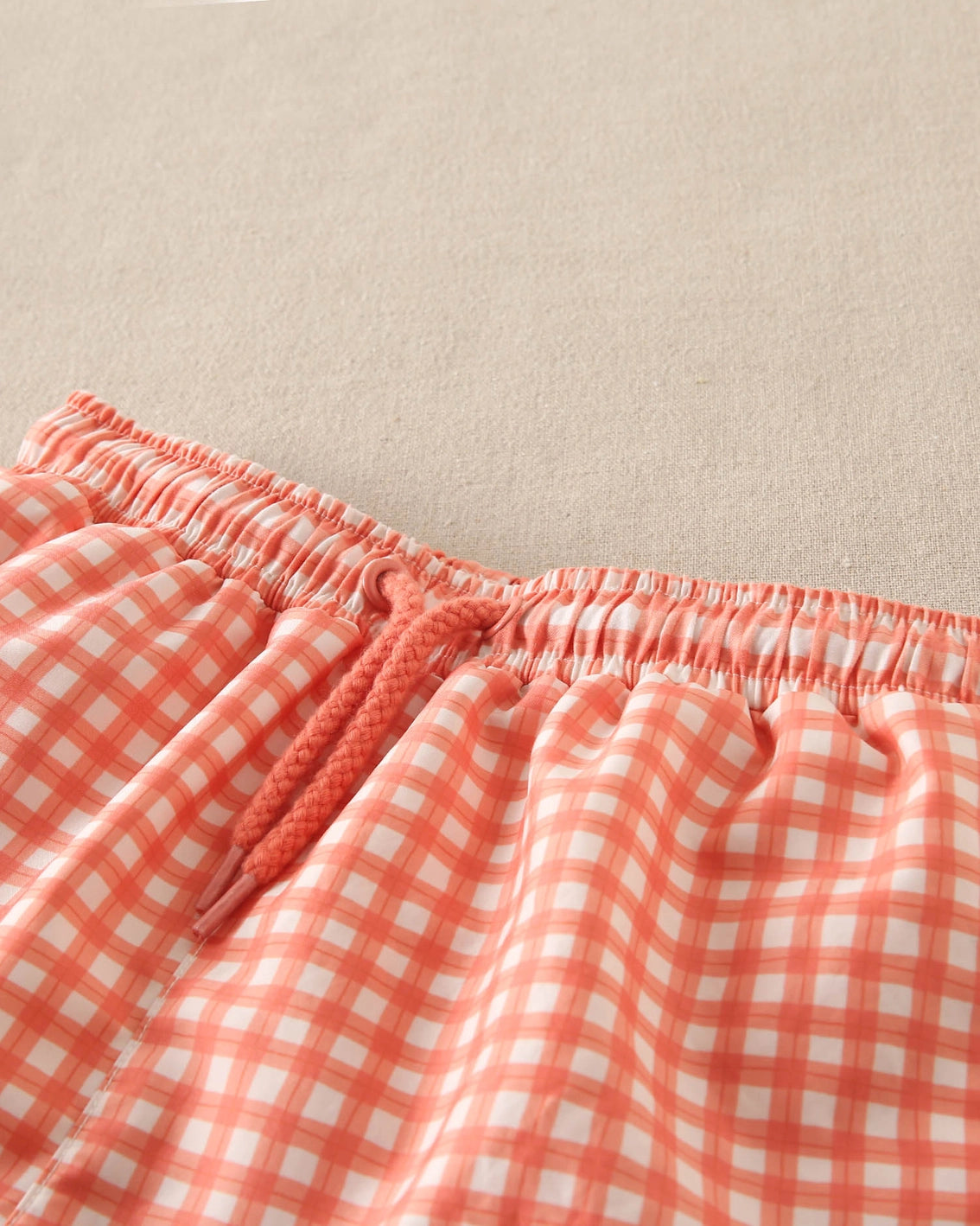 Costume boxer a quadretti arancioni e bianchi
