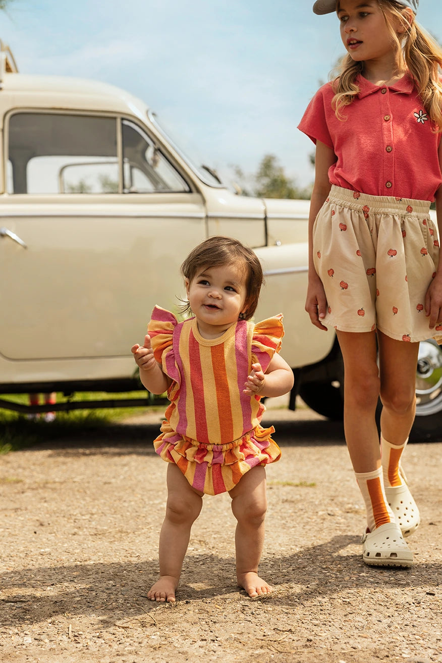 Shorts con mele all-over
