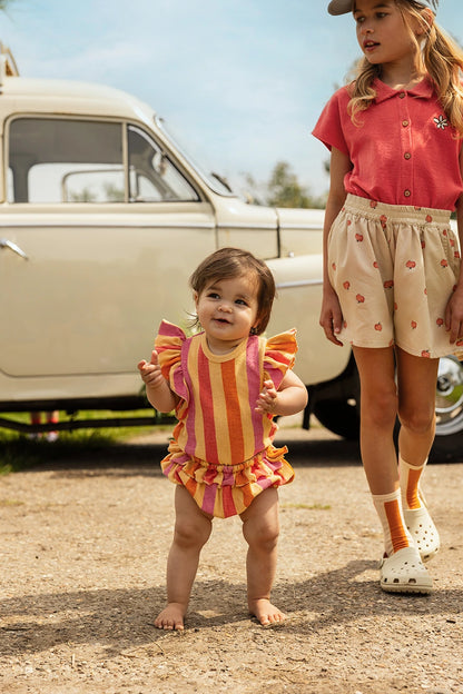 Shorts con mele all-over