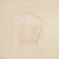 Camicia beige maniche lunghe con balze