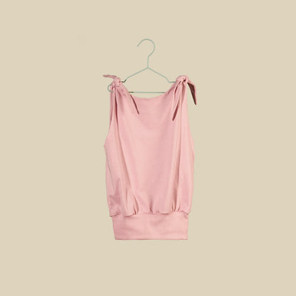 Top o mini abito rosa chiaro senza maniche con nodi