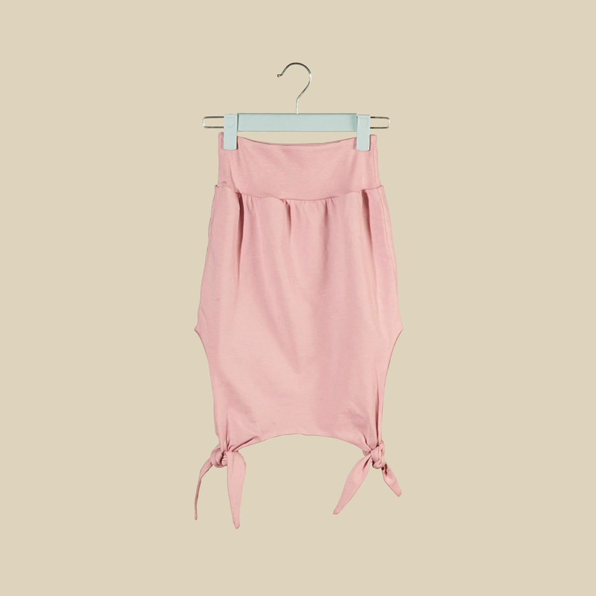 Top o mini abito rosa chiaro senza maniche con nodi