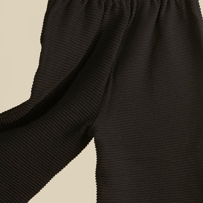 Pantalone nero in tessuto cannetté gamba larga