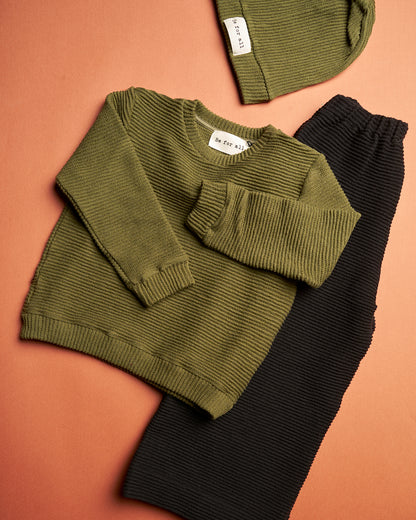 Maglione verde militare in tessuto canneté